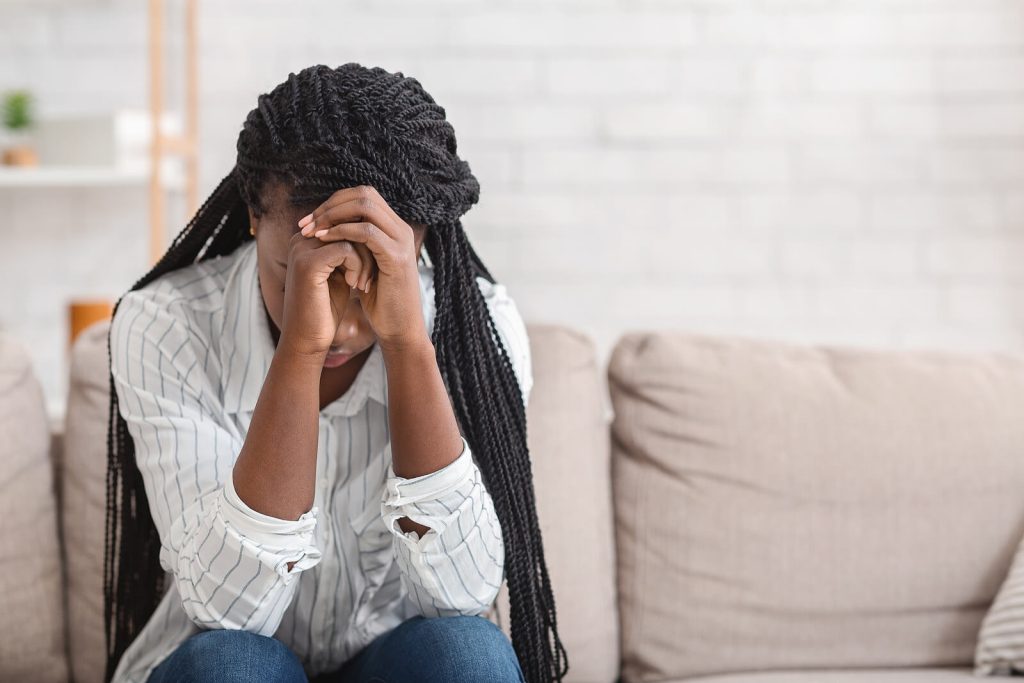 African American woman struggling with anxiety. Anxiety does not have to control your life. There is hope. Anxiety treatment in Arizona can help you overcome your anxiety in a positive, long lasting way.